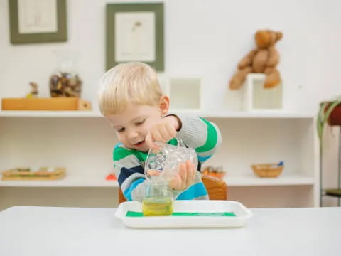 a baby sitting at a table