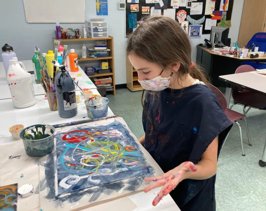 a young girl painting