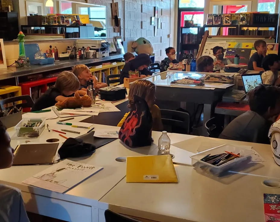 a group of people sitting at tables