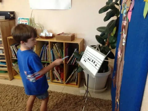 a boy playing with a toy