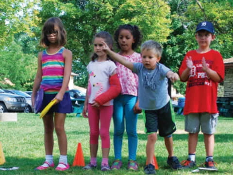 a group of children posing for a photo