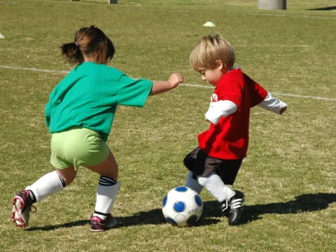 kids playing with a football ball