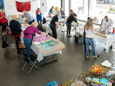 a group of people painting