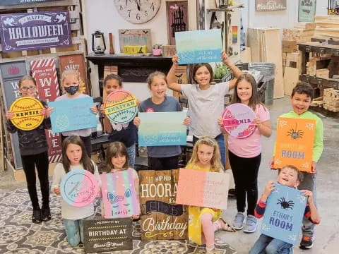 a group of children holding signs