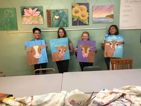 a group of people holding books