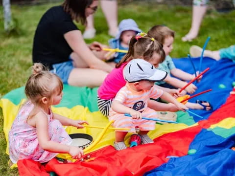 a group of children on a blanket