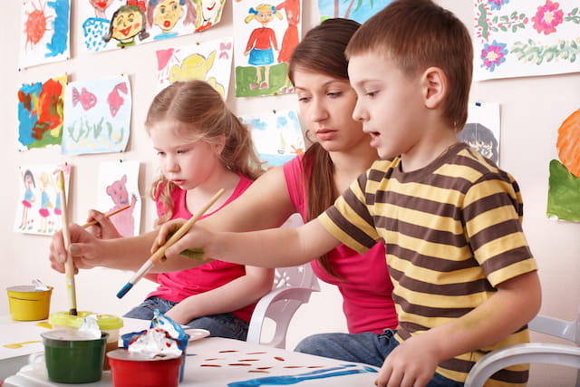 a group of children painting