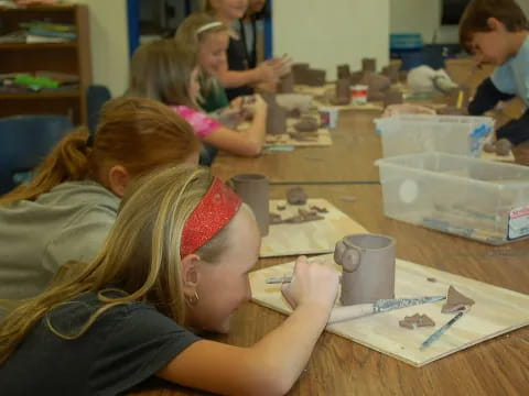 a group of children painting
