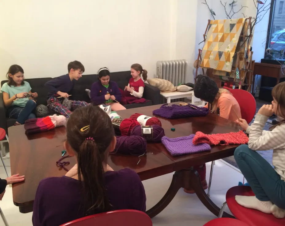 a group of people sitting around a table