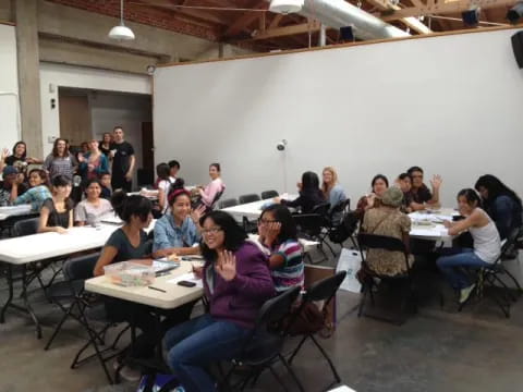 a group of people sitting at tables