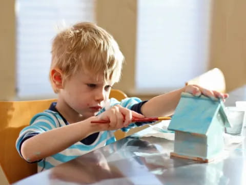 a young boy brushing his teeth