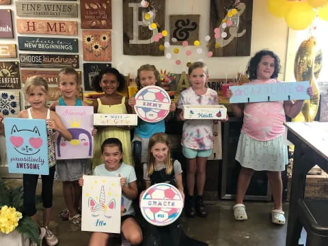 a group of children holding signs