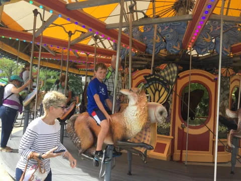 a person riding a fake horse