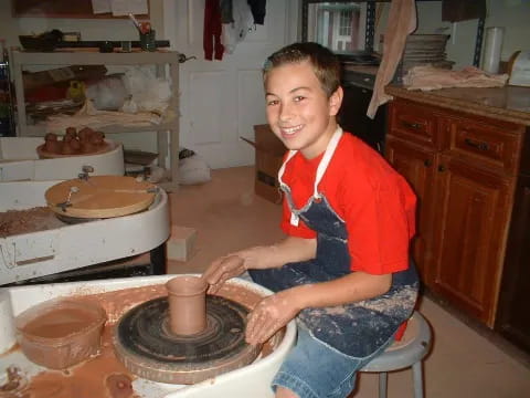 a boy sitting at a table
