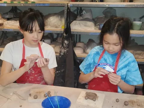 a couple of young girls painting