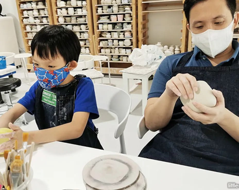 a couple of boys wearing masks