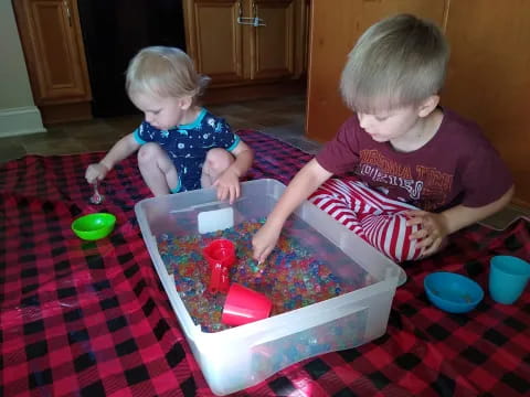 two children playing with toys