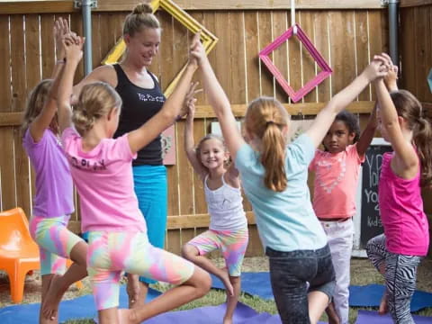 a group of children playing on a mat