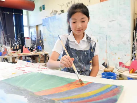 a young girl painting