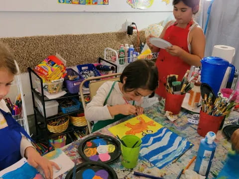 a group of children painting