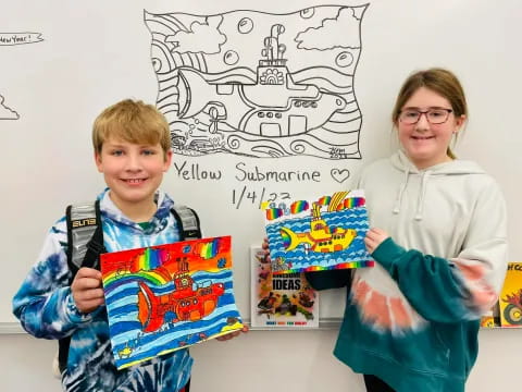 a person and a boy holding books