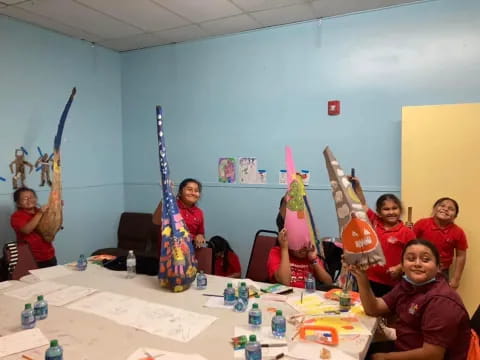 a group of kids in red shirts