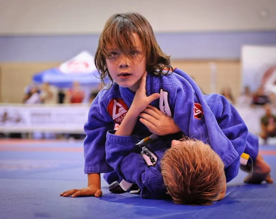 a young girl kneeling on the floor