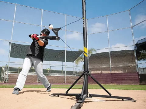 a baseball player swinging a bat