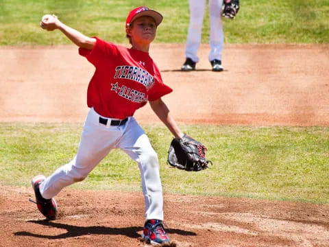 a baseball player throwing a ball