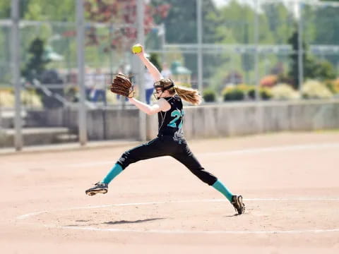 a person catching a baseball