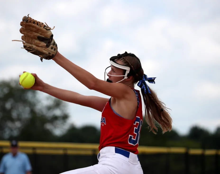 a person throwing a baseball