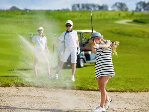 a group of people playing golf