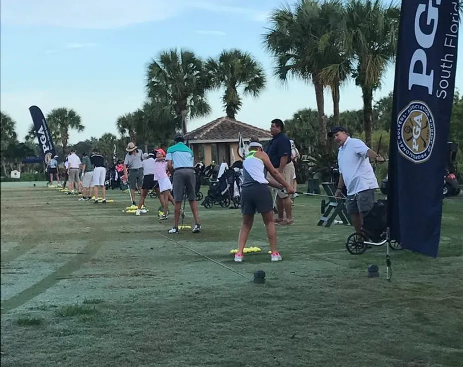 a group of people playing golf