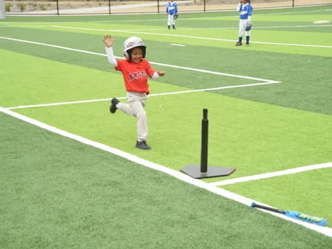 a boy running on a football field