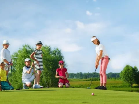 a group of people playing golf