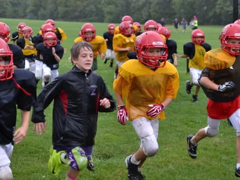 a group of kids playing football