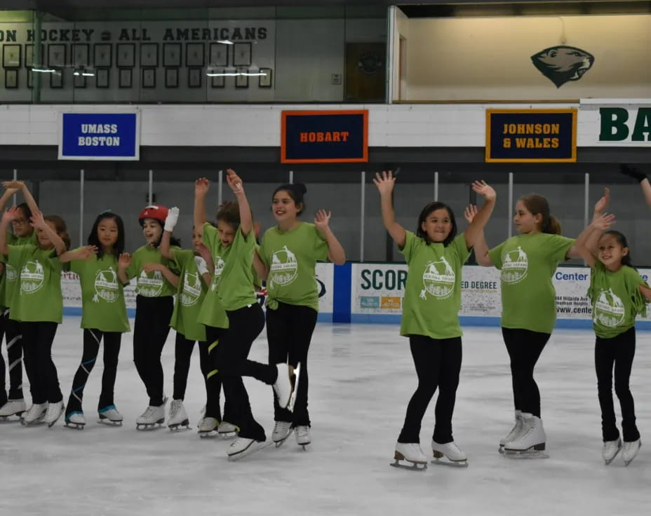 a group of women ice skating