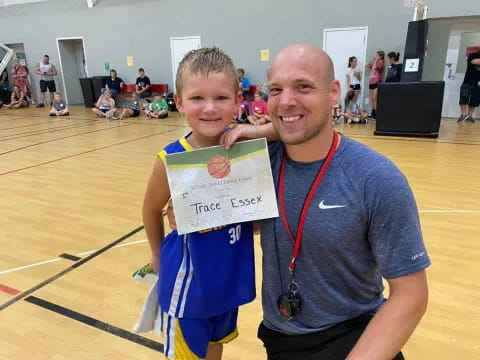 a person and a boy posing for a picture