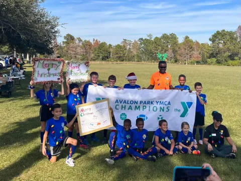 a group of people holding a sign
