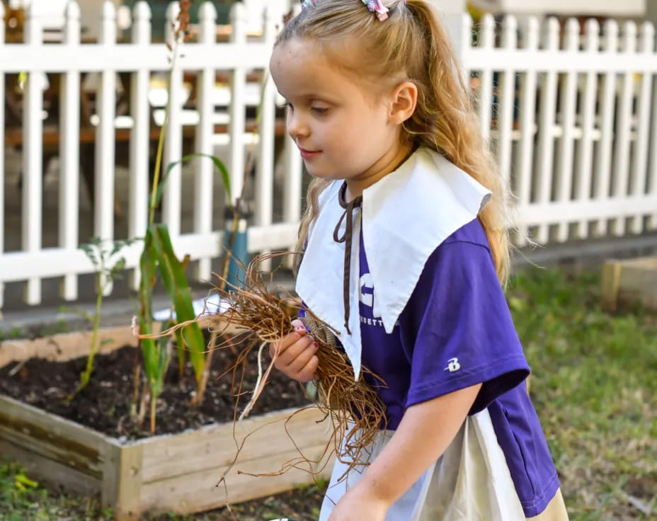 a girl holding a snake
