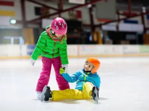 a person and a child ice skating
