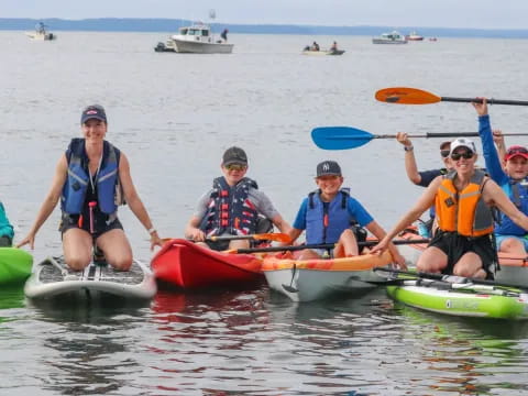 a group of people in kayaks