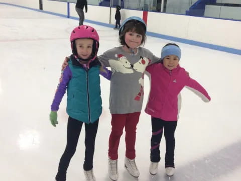 a group of girls on an ice rink