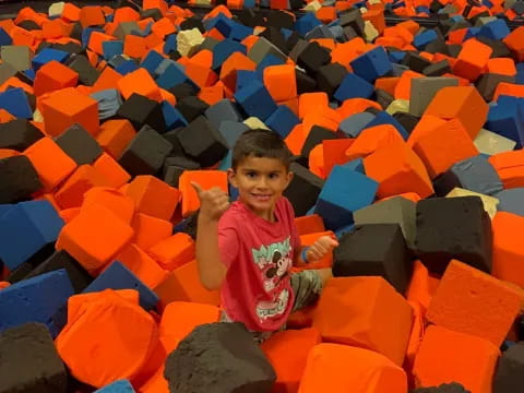 a boy in a sand castle
