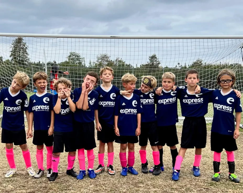a group of girls in blue shirts