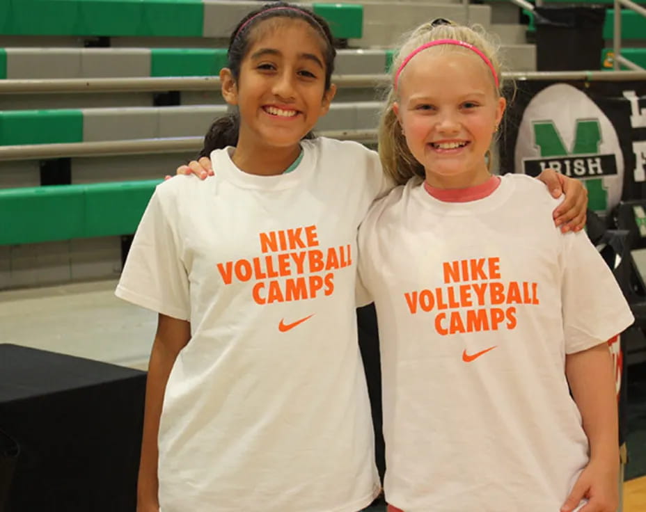 two girls wearing white shirts