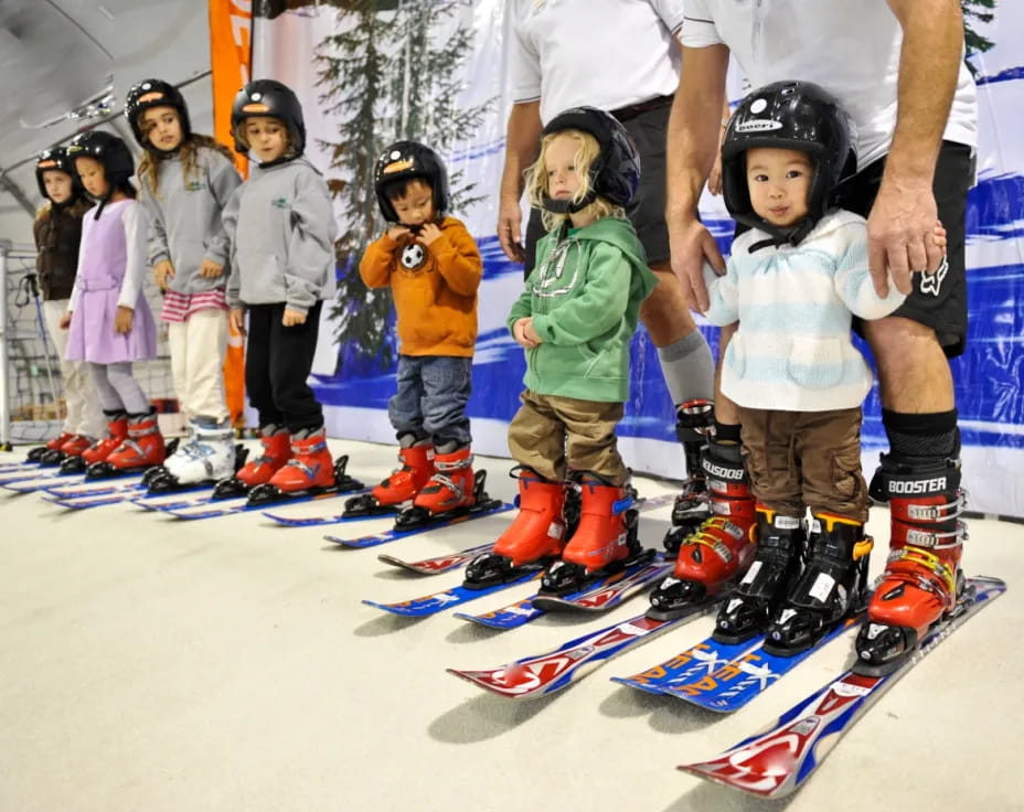 kids on skis in snow