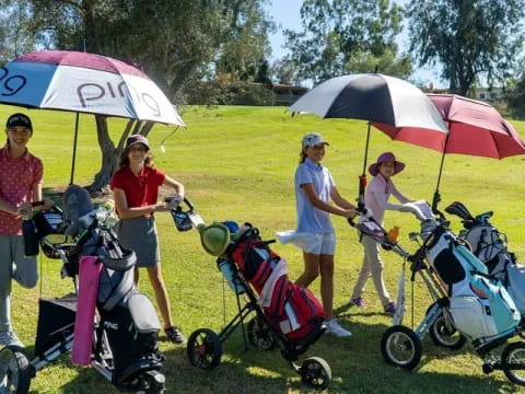 a group of women with umbrellas