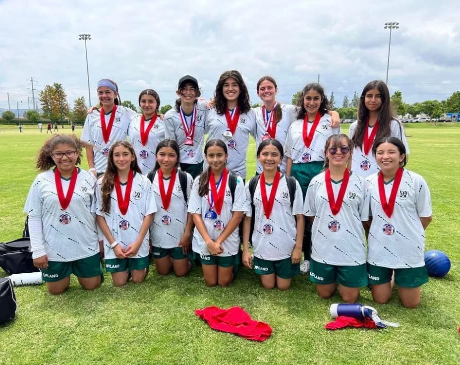 a group of people wearing medals