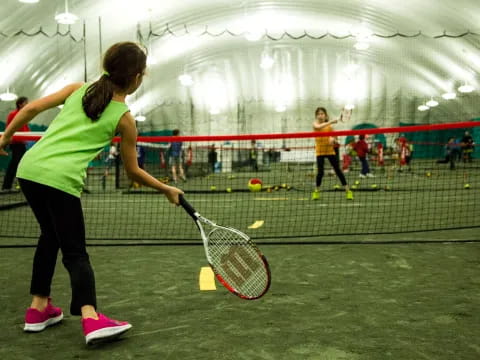 a person holding a tennis racket